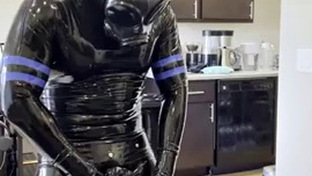 Rubberdrone jerks off in latex socks
