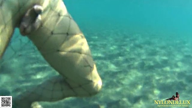 fishnet stocking in public sea and beach