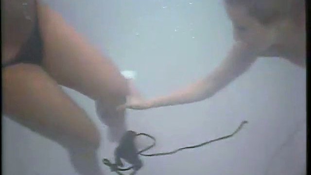 lesbians angel and christi in pool - more of them at grope-cam.com