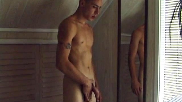 This tattooed hottie wants us to watch him jerk off. Bradley walks in and immediately takes charge of the task at hand. He starts a porn video, oils up his cock and squirts a healthy load of cum on a mirror.
