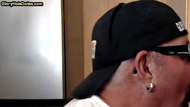 Gloryhole DILF sucks her boyfriend's cock in a close-up homemade video
