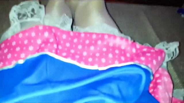 Charming crossdresser ties a red dildo with his dick