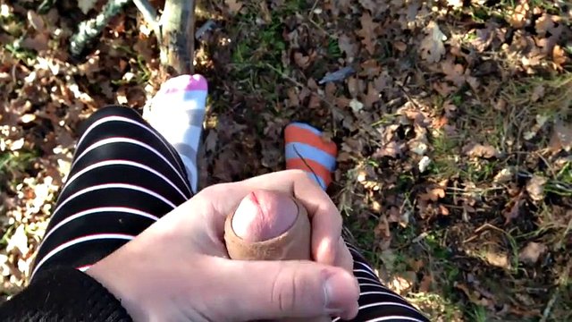 cute teen boy in his pajamas in the woods jerking