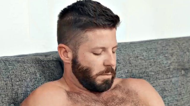 Solo hairy jock with athletic body jerks his cock after casting