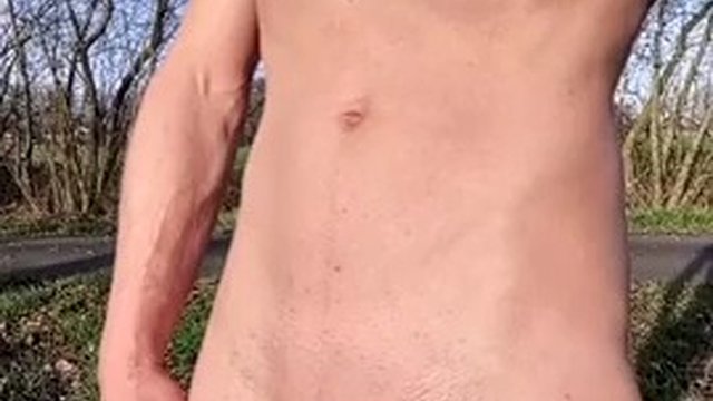 Almost caught. Skinny boy is naked in nature. Jerking off his big cock and pissing in the morning sun