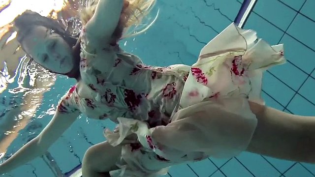 lucy takes the dress off showing her hairy pussy and titties underwater