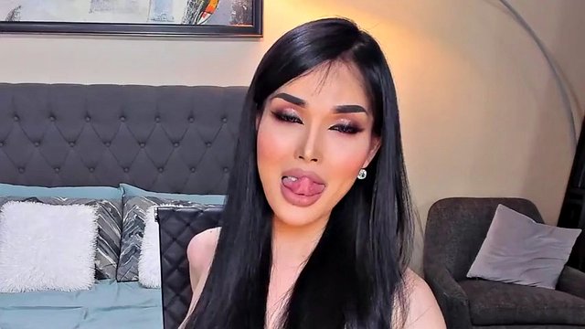 Beautiful shemale smokes on camera