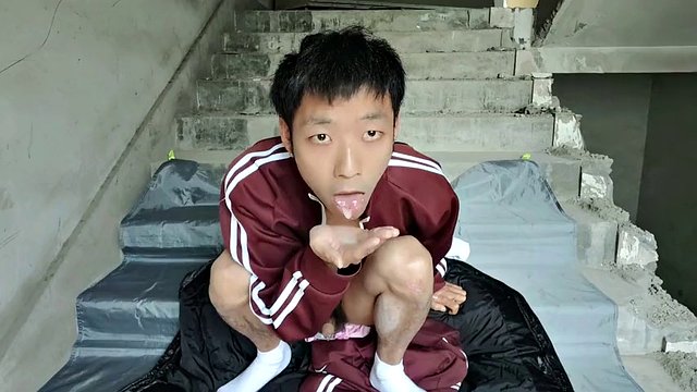 Cute Asian boy masturbates and ejaculates in the stairwell of construction site