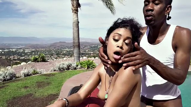 Oiled up ebony babe with medium tits fucked by big black cock outdoors by the pool