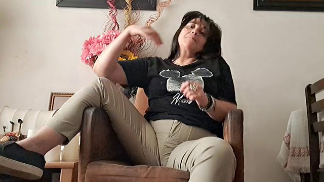 woman taking off her clothes suggesting sex