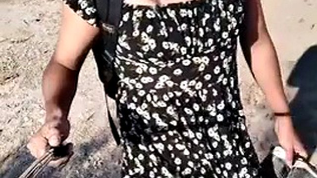 Beautiful ladyboy in mini dress and sandals walks in very hot