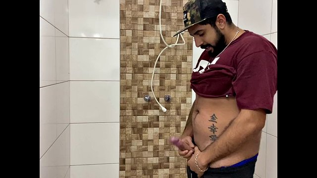 Squirting cum, bearded man with a cap alone in the bathroom having fun in the handjob until he cums a lot - Rodrik Dick