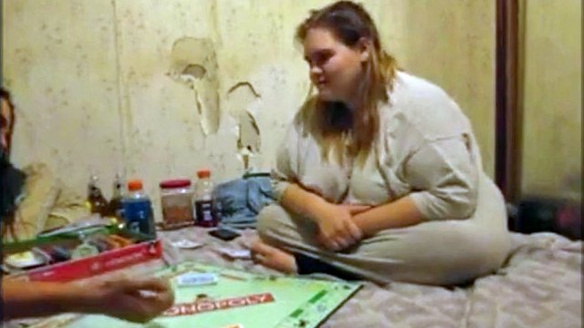 Woman loses at Monopoly and sells her pussy for a bank loan to continue playing