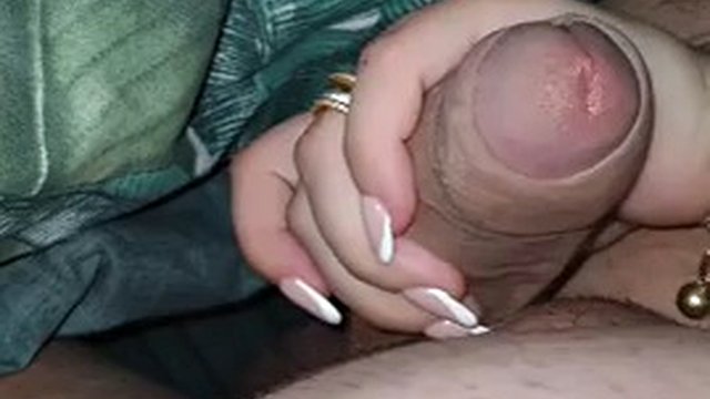 Stepmother gets excited with her stepson's big erection and masturbates his cock with her hand