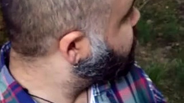 Bearded bear suicking cock in the woods