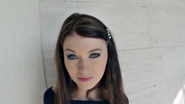 Tasty teen with mesmerizing blue eyes plays with a dildo
