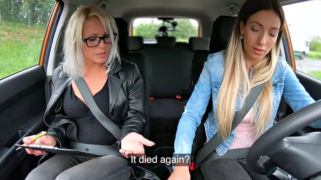 Busty lez babe enjoys dildo car sex with driving tutor